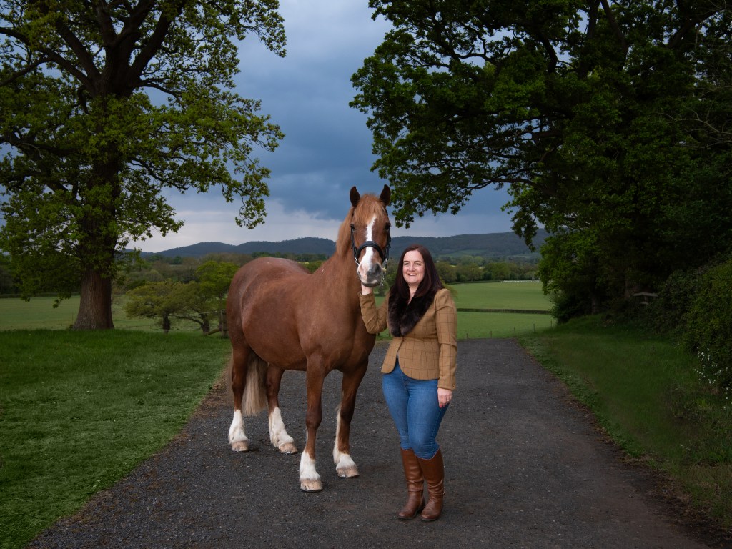 Horse and rider portrait with Malvern Hills in the background.