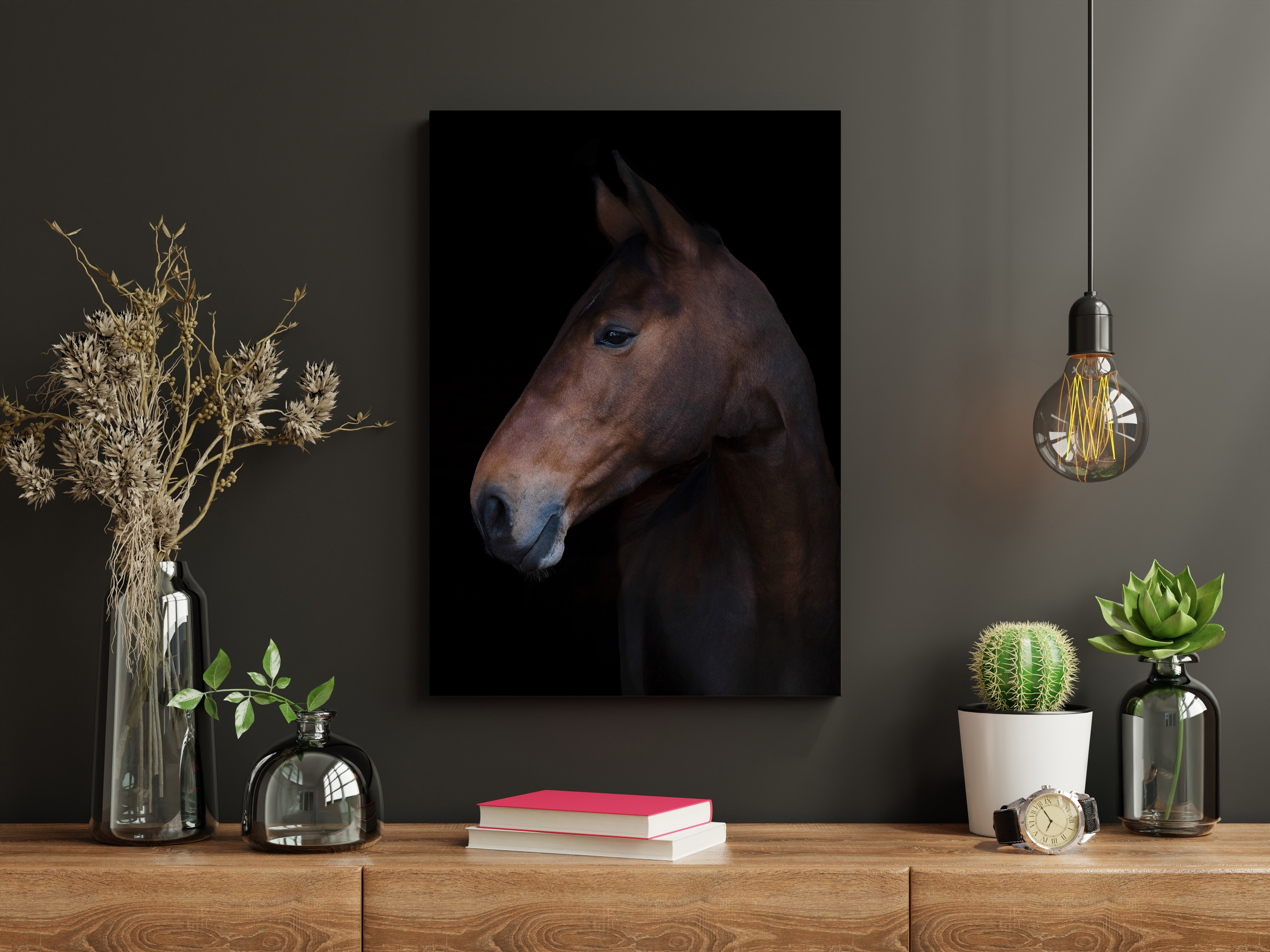 Black black ground horse portrait hanging on a wall over a check of drawers.